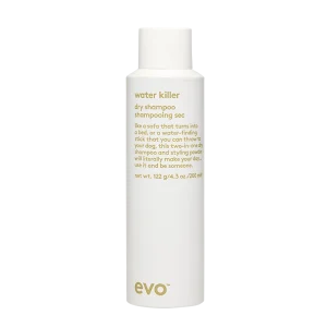 A sleek, white bottle contains dry shampoo, labeled for waterless cleansing
