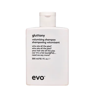 A white shampoo bottle features playful text and a minimalist design