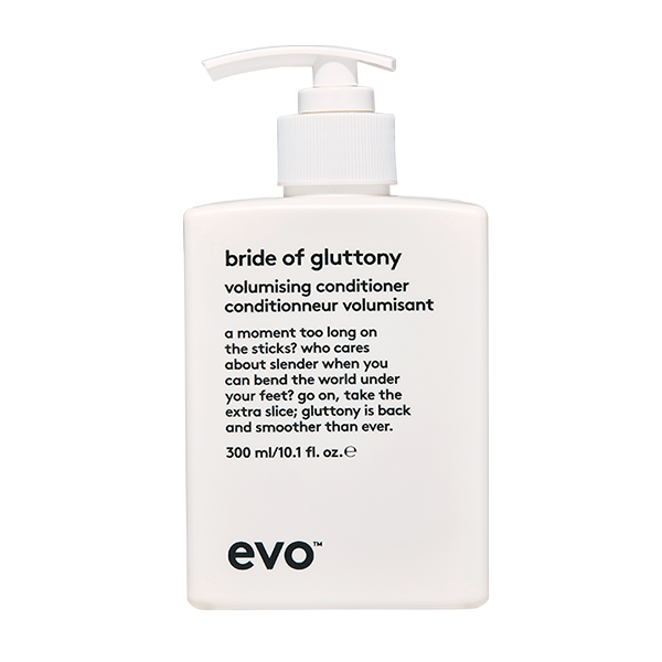 A white conditioner bottle features playful text and a sleek pump dispenser