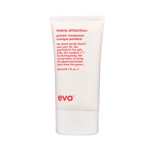 A sleek, white tube of hair treatment product with red text stands upright