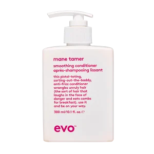 A sleek white bottle with a pump top displays a smoothing conditioner label