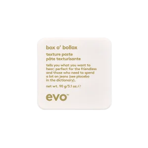 A small, square container of texture paste with playful text and minimalist design