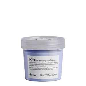 A lavender-colored conditioner in a clear jar with a white lid