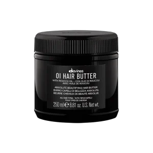 A sleek black jar of hair butter surrounded by a minimalist design
