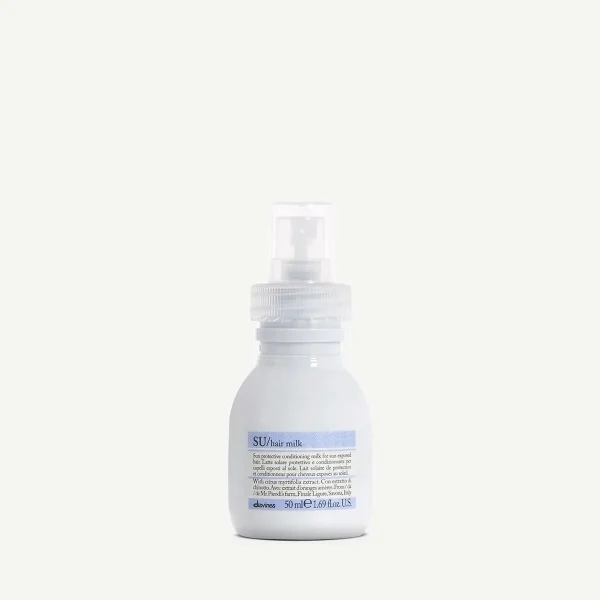 A small white bottle with a spray top sits on a light background