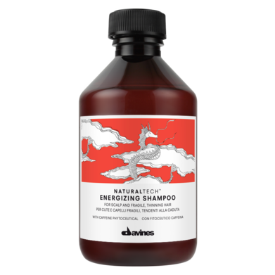 A bottle of shampoo features a dragon design on a vibrant red background