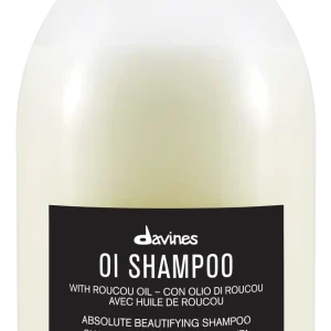 A bottle of OI shampoo with a minimalist design and black label