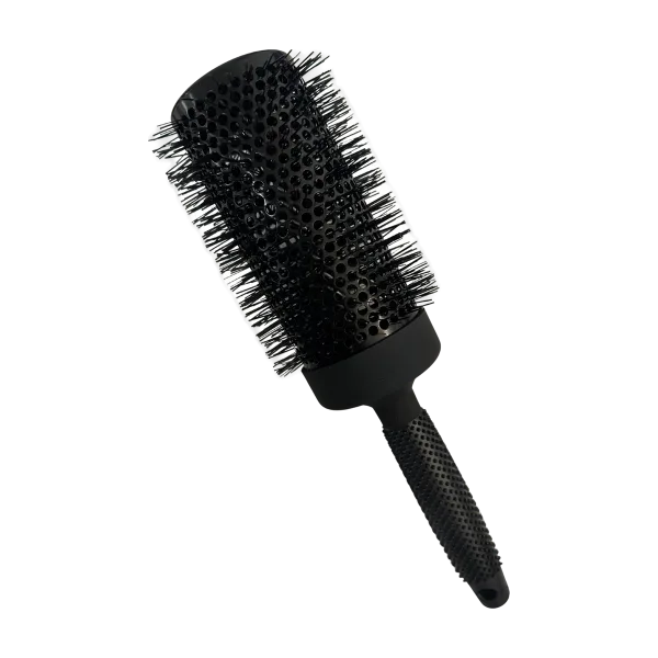 A round brush with a textured handle and bristles for hairstyling