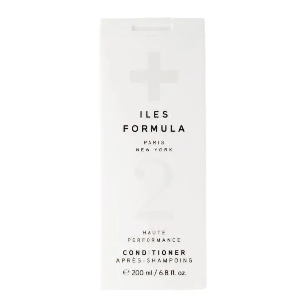 A sleek, minimalist white container showcases a premium conditioner with a stylish design