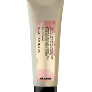 A tube of skincare cream reveals its smooth, creamy texture and elegant branding