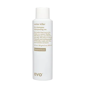 A white bottle of dry shampoo with minimalist branding and product details