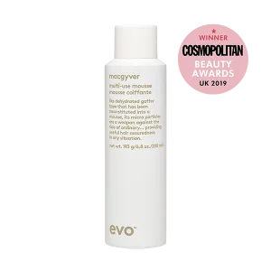A sleek bottle of styling mousse features award badges and minimalistic design
