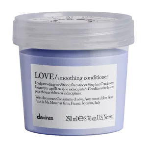A lavender-colored container holds smoothing conditioner, labeled with product details and weight