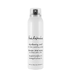 A sleek, white spray bottle with black text and a nozzle at the top