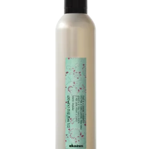 A sleek bottle of shampoo features floral design elements and informative labeling