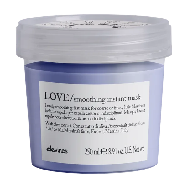 A lavender hair mask container sits on a light background, showcasing its product label