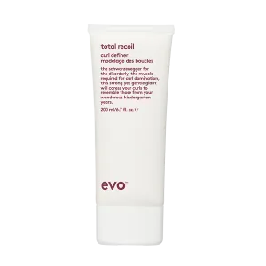 A white tube of curl defining cream stands upright against a plain background