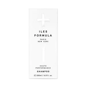 A sleek, minimalist shampoo bottle with a simple design and bold text