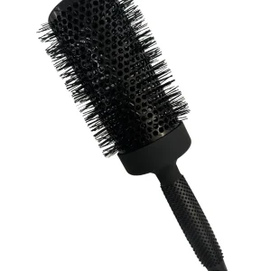 A round, black hairbrush with bristles designed for styling and smoothing hair