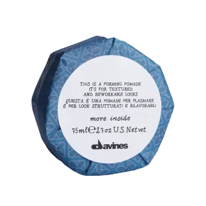 A circular container with patterned packaging labeled as a forming pomade