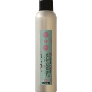 A sleek, silver bottle with a decorative label is displayed upright