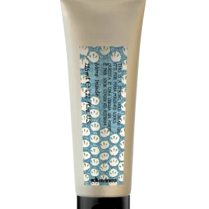 A tube of cream features a playful label with smiling faces and bright colors