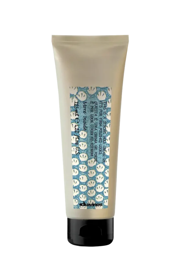 A tube of cream features a playful label with smiling faces and bright colors
