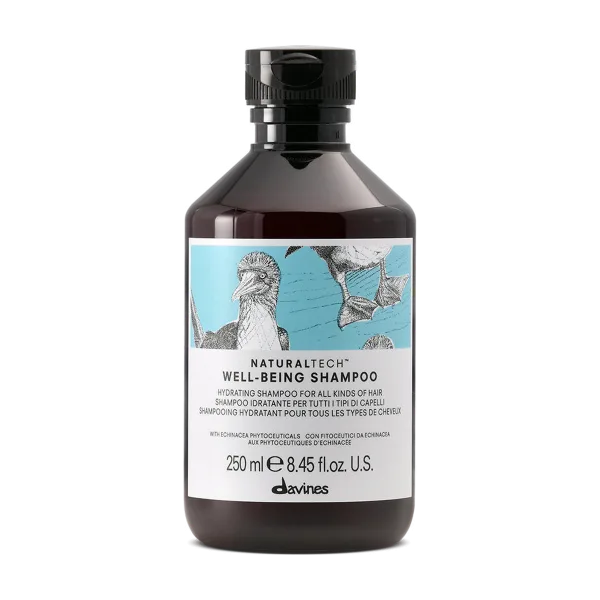 A bottle of shampoo features a detailed illustration of birds on a vibrant label